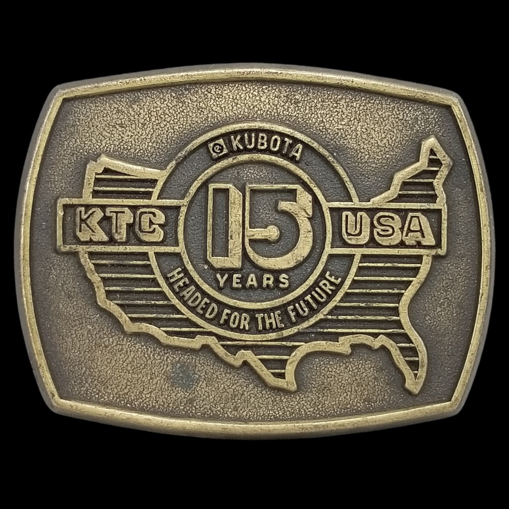 Vintage KTC Kubota USA 15 Years Headed for the Future Brass Belt Buckle‎